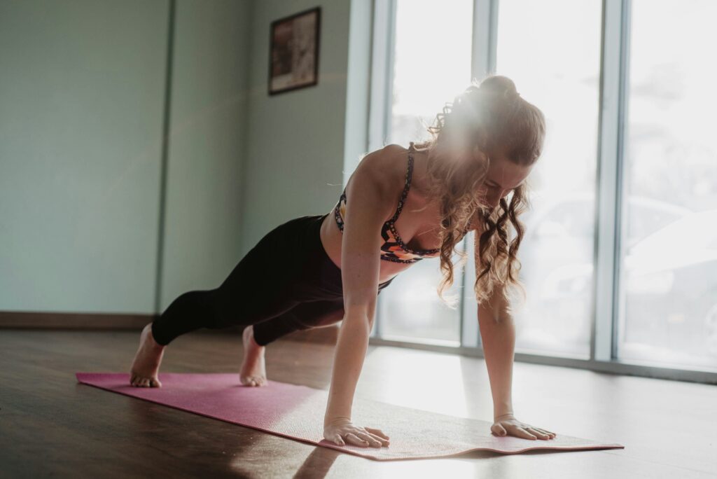 Woman doing a plank as part of her mobility routine during menopause